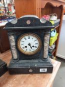 A black slate mantle clock with marble columns, no key, no pendulum, both springs ok, missing