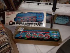 A boxed tin plate friction International Express locomotive
