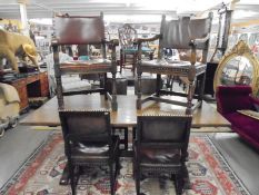 An oak refectory style table with two carvers and four dining chairs, COLLECT ONLY.