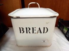 A vintage heavy enamel bread bin