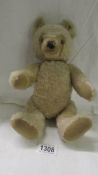 An old Steiff teddy bear, with button in ear.