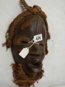 An African Mwana Pwo style mask, 30 x 19 cm.