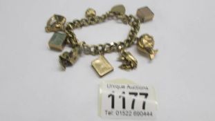 A 9ct gold charm bracelet, 49.4 grms.