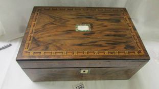 A good Victorian mahogany writing slope with ink bottles.