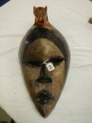 A large African traditional tribal mask, 46 x 27 cm.