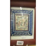 A framed and glazed Chinese embroidery.