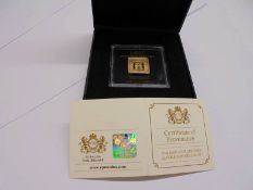 A 2019 Lion and Unicorn 5 gram gold square ingot.