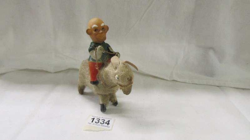 A man on donkey clockwork toy, Made in Japan.