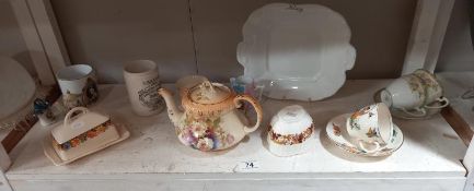 A mixed lot of ceramics including teapot, butter dish, cups, saucers etc