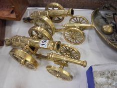 Two pairs of solid brass cannons.