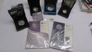 Four case coins - £5 Silver Paralympic coin, £2 silver 2011 King James Bible, A silver 2012 Olympics