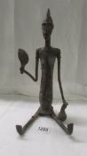 A bronze African seated lady, 37 cm tall, age unknown.