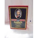 A boxed Grant's 25 years old very rare Scotch whisky with Royal Doulton William Grant character jug.