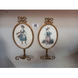 A pair of brass coat/hat hooks with oval brevettato plaques (height 28cm)