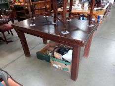 A dark wood stained dining table (140cm x 79cm x 78cm high)