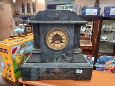 A large black slate mantle clock with brass ormalu embellishments, no key, no pendulum, springs ok