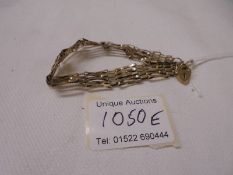 A 9ct gold gate bracelet, 8.2 grams.