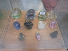 A mixed lot of glass paperweights including animal examples. (11 in total).