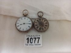 Two silver pocket watches in working order.