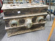 A large heavy bronze-decorated trunk.