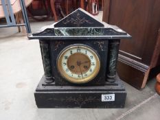 A black slate mantle clock with pendulum, no key, springs ok