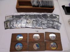 Approximately 40 magic lantern slides and six others in wooden frames.