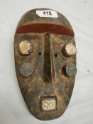 An African Grebo style mask, 30 x 17 cm.