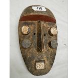 An African Grebo style mask, 30 x 17 cm.