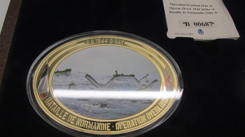 A cased '70th Anniversary of D-Day' coin set. - Image 4 of 6