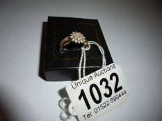 A 18ct yellow gold diamond floral ring, size L, 2.2 grams.