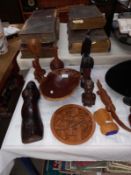 A quantity of carved wooden items including African bust