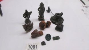 A mixed lot of oriental metal figures, stone figures, netsuke and a chamber candlestick.