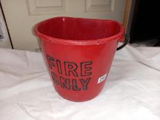 A vintage plastic embossed 'Fire Only' bucket