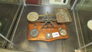 A set of brass postal scales.