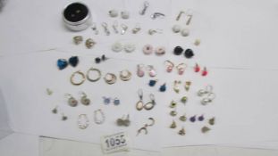 Approximately 33 pairs of vintage earrings including some silver.