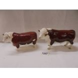 Two Beswick bulls.