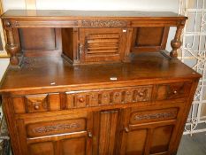 A mid-20th century oak sideboard in good condition, COLLECT ONLY.