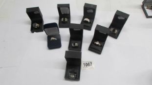 Eight boxed dress rings including Danbury Mint.
