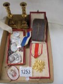 A mixed lot of religious items including Popes Medal, brass candlesticks etc.,