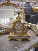 A French style ormolu clock with Sevres panels. COLLECT ONLY