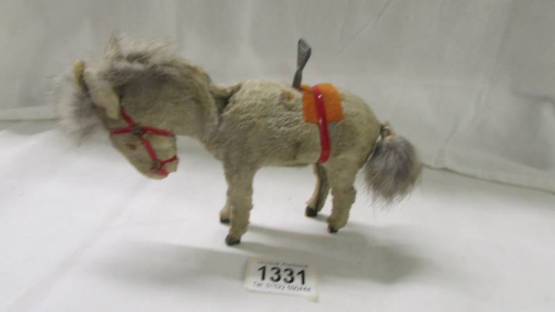 A Bucking horse clockwork toy, Made in China, working.