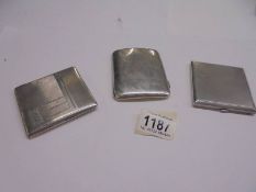 Two silver cigarette cases and a silver powder compact, total weight 295 grams.