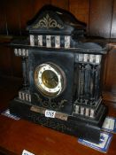 An old slate mantel clock, springs ok.