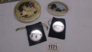 A large 'Icons of Britian' coin of Westminster abbey, an oval D Day coin and 2 The Great war coins.