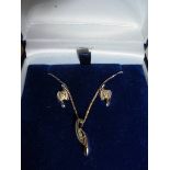 A three piece white gold diamond pendant and earring set, 9ct.