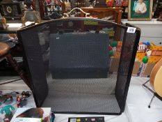 A modern brass and mesh fire screen. COLLECT ONLY
