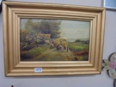 A gilt framed oil on canvas farm scene.