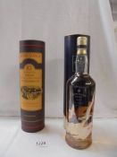 A bottle of Glenmorangie and a bottle of Bowmore Surf single malt Scotch whisky.