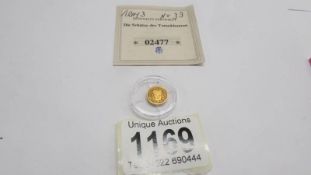 A gold tut-Ank-Hamun coin, 0.5 grams/