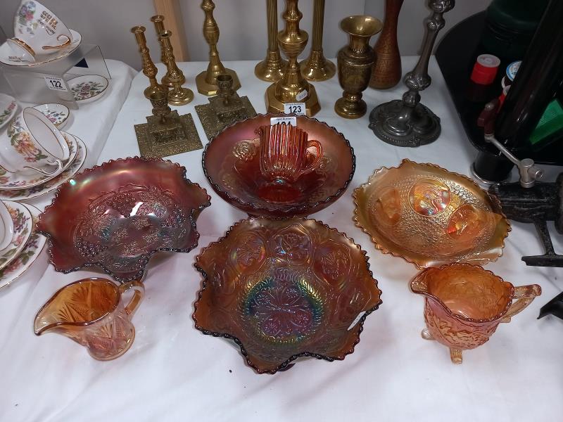 A quantity of mostly orange iridescent carnival glass